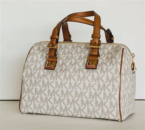 como identificar una bolsa original michael kors|bolsos Michael Kors.